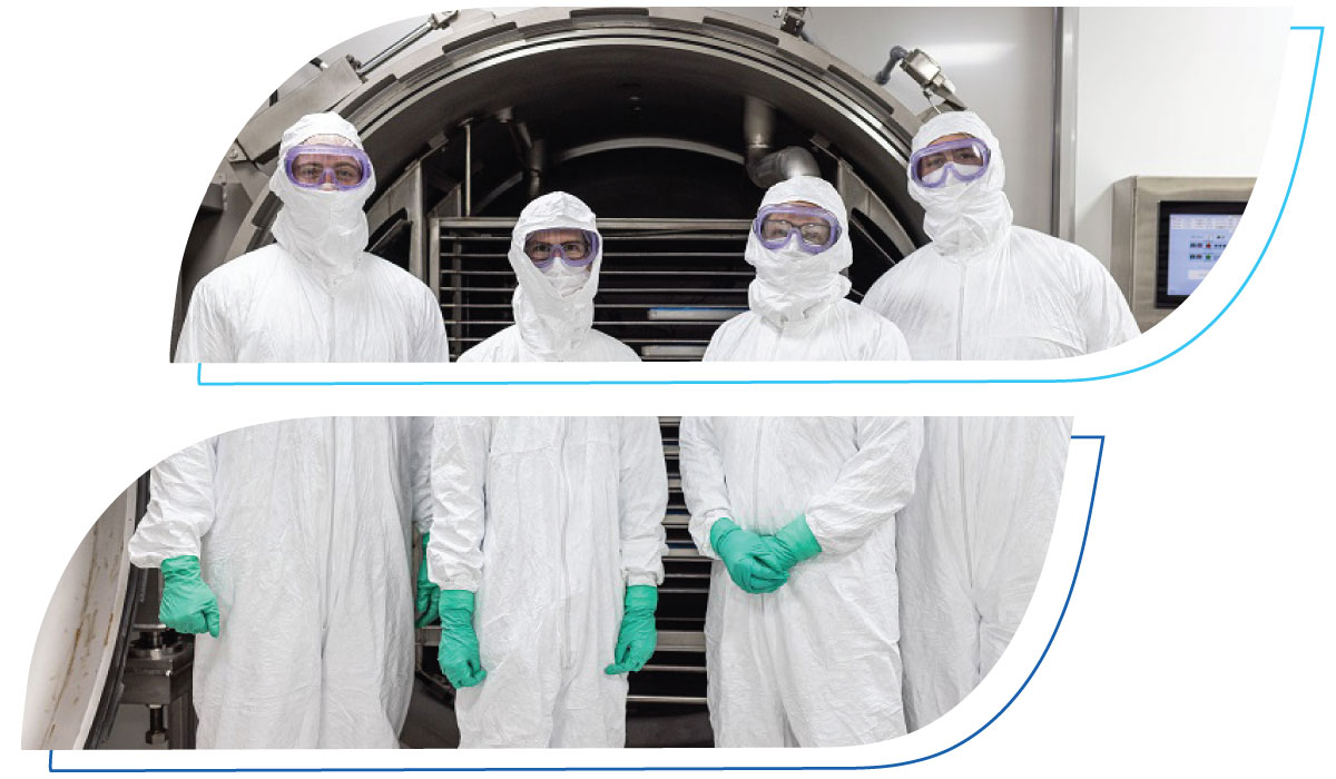 OFD Life Sciences scientists in front of freeze drying chamber